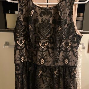Lace back dress. Hits above knee. Elegant and worn once. Sleeveless.
